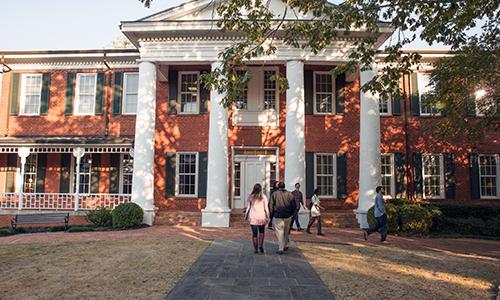 Students approach Smith Hall, which dates to 1850.